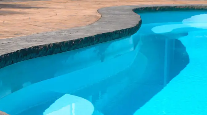fiberglass pool concrete edge 672x372